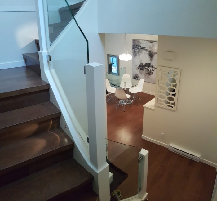 A modern and fancy staircase and dining area